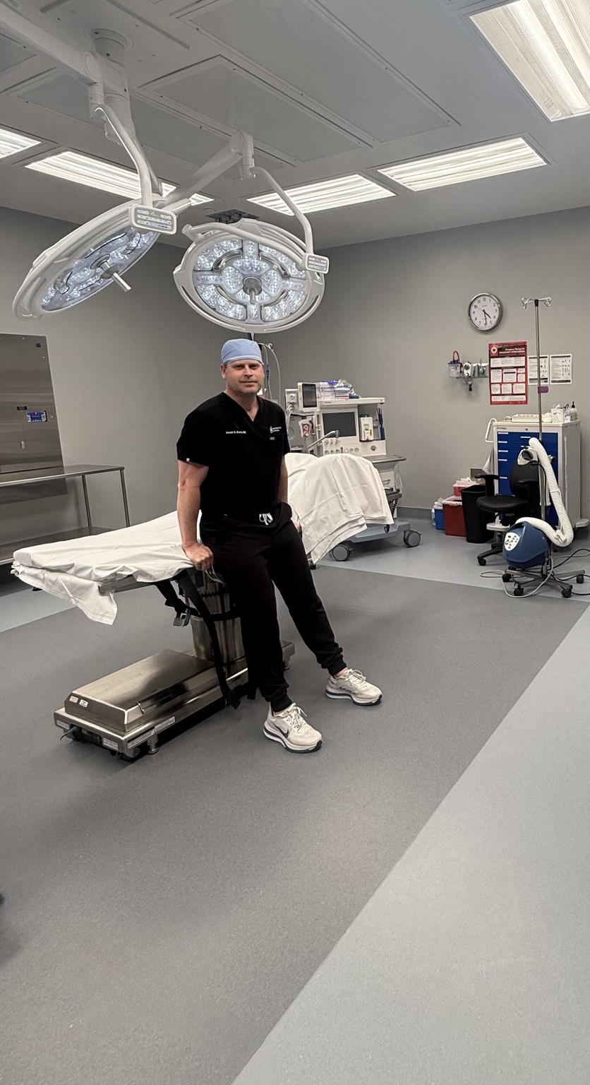 Keven S. Burns, MD standing in an operating room